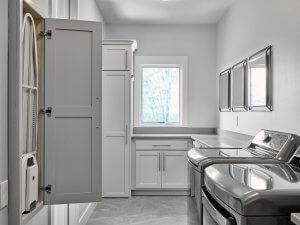 Laundry room with fold down ironing board and counter space