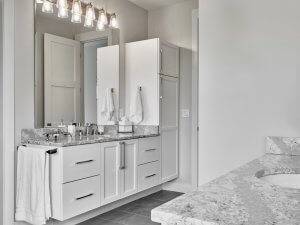 master bathroom with dual vanity and quartz countertops