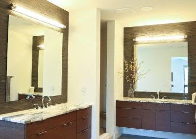 Master bath with floating vanities, dual sinks and polished concrete flooring.