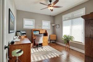 Office space with hardwood flooring and Pella windows.