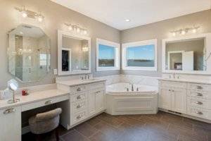 Dual vanities in this premier bathroom suite.