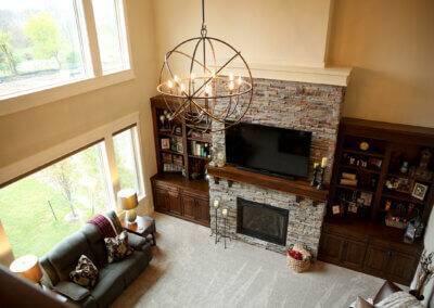 Overlooking into great room with stone fireplace and custom built ins.