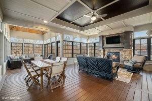 Large three season patio, screened in with windows, fireplace, mounted television and several sitting areas.