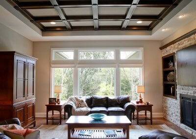 Great room with wooden beam ceiling treatments