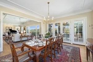 Dining table with view to sitting room and covered patio